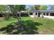 This back yard provides plenty of green space and trees, perfect for playing or relaxing at 2225 E Welch Rd, Apopka, FL 32712