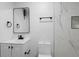 This bathroom features white cabinets, dark fixtures, modern mirror, and an efficient water closet at 2225 E Welch Rd, Apopka, FL 32712