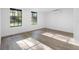 Well-lit bedroom with wood-look floors and natural light, with a view to the backyard at 2225 E Welch Rd, Apopka, FL 32712