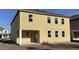 New construction shows a two-story home with covered patio; ready for landscaping at 2286 Broadbrook Dr, St Cloud, FL 34771