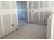 Unfinished hallway displaying drywall and modern electrical outlets at 2286 Broadbrook Dr, St Cloud, FL 34771