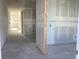 Unfinished interior space with a long hallway ready for customization at 2286 Broadbrook Dr, St Cloud, FL 34771