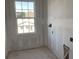 Unfinished room displaying drywall and a modern window at 2286 Broadbrook Dr, St Cloud, FL 34771