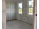 Unfinished room displaying drywall, two windows, and modern electrical outlets at 2286 Broadbrook Dr, St Cloud, FL 34771