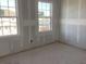 Unfinished room displaying drywall and modern windows at 2286 Broadbrook Dr, St Cloud, FL 34771