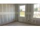 Unfinished room displaying drywall and modern windows at 2286 Broadbrook Dr, St Cloud, FL 34771