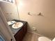 Bathroom featuring double sinks, large mirror, toilet, and tiled flooring at 255 Sandlewood Trl, Winter Park, FL 32789
