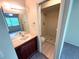 Bathroom with vanity, mirror, toilet, and walk-in shower at 255 Sandlewood Trl, Winter Park, FL 32789