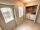 Laundry room with washer, dryer, a window and storage cabinet at 255 Sandlewood Trl, Winter Park, FL 32789
