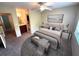 Well-staged primary bedroom with ceiling fan and ensuite bathroom at 255 Sandlewood Trl, Winter Park, FL 32789