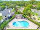 Aerial view of community pool surrounded by brick patio at 255 Sandlewood Trl, Winter Park, FL 32789