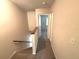 Carpeted stairwell leading to an upstairs hallway with views into a room at 255 Sandlewood Trl, Winter Park, FL 32789