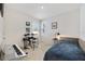 Well lit bedroom with a neutral color scheme and musical instruments at 2827 Turnstone Run, Harmony, FL 34773