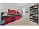 Cozy bedroom with a unique bunk bed fort, desk, and bookshelf for storage at 2827 Turnstone Run, Harmony, FL 34773