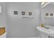 Cozy half-bathroom features modern fixtures and a clean design for everyday convenience at 2914 Clarabelle Ct, Kissimmee, FL 34743
