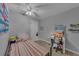 Cozy bedroom with desk, chair, and new vinyl flooring at 2914 Clarabelle Ct, Kissimmee, FL 34743