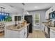 Functional kitchen featuring granite countertops, stainless steel appliances, and a serving bar to the dining area at 2914 Clarabelle Ct, Kissimmee, FL 34743