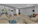 Bright and airy living room with hardwood floors, couches, and an open layout, perfect for entertaining at 2914 Clarabelle Ct, Kissimmee, FL 34743