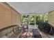 Relaxing screened patio with comfortable seating and view of lush greenery at 2914 Clarabelle Ct, Kissimmee, FL 34743
