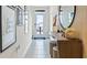 Welcoming foyer with decor and stylish console table with mirror at 2929 Canary Ave, Davenport, FL 33837