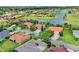 This home is located in a beautiful community with water views, a golf course, and mature landscaping at 313 Sorrento Rd, Poinciana, FL 34759
