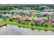This home is located in a beautiful community with water views, a golf course, and mature landscaping at 313 Sorrento Rd, Poinciana, FL 34759