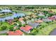 Beautiful aerial view of homes and a golf course community, featuring serene lakes and lush green landscapes at 313 Sorrento Rd, Poinciana, FL 34759