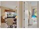 Hallway with views into living room and bedroom provides convenient access throughout the home at 313 Sorrento Rd, Poinciana, FL 34759