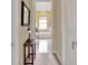 Hallway view of a bathroom with a soaking tub under a window at 313 Sorrento Rd, Poinciana, FL 34759