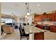 Open concept kitchen and living room with granite countertops and a seamless flow for modern living at 313 Sorrento Rd, Poinciana, FL 34759