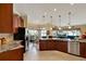 Open kitchen with modern appliances, ample counter space, and view of the living area at 313 Sorrento Rd, Poinciana, FL 34759