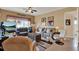 Spacious living room with plush seating, decorative accents, and a large television at 313 Sorrento Rd, Poinciana, FL 34759