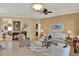 Cozy living room featuring stylish furnishings, decorative accents, and a ceiling fan at 313 Sorrento Rd, Poinciana, FL 34759