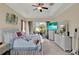 Spacious main bedroom with sliding glass door access to the outdoors and matching furniture at 313 Sorrento Rd, Poinciana, FL 34759