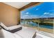 Spacious balcony with lounge chairs and views of the serene water feature at 3228 Brasilia Ave, Kissimmee, FL 34747