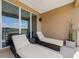 Relaxing balcony showcasing lounge chairs, outside view, and modern design, perfect for enjoying the outdoors at 3228 Brasilia Ave, Kissimmee, FL 34747