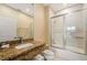 Bathroom featuring a granite vanity, sink, mirror, shower, and toilet at 3228 Brasilia Ave, Kissimmee, FL 34747