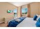 Relaxing bedroom with a king-size bed, a TV, and access to a balcony overlooking water at 3228 Brasilia Ave, Kissimmee, FL 34747
