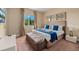 Well-lit bedroom with king-size bed, neutral decor, and view from a large window at 3228 Brasilia Ave, Kissimmee, FL 34747