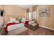 Comfortable bedroom with two beds, neutral decor, and a small painting on the wall at 3228 Brasilia Ave, Kissimmee, FL 34747