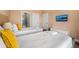 Inviting bedroom featuring two twin beds, a TV, and direct access to the bathroom at 3228 Brasilia Ave, Kissimmee, FL 34747