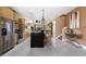 Modern kitchen with stainless appliances, granite counters, breakfast bar, and bright lighting at 3228 Brasilia Ave, Kissimmee, FL 34747