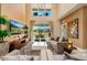 Bright living room featuring soaring ceilings, plush seating, and a view of the outdoors at 3228 Brasilia Ave, Kissimmee, FL 34747
