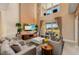 Spacious living room with comfortable sofas, a large TV, and a view of the patio and water at 3228 Brasilia Ave, Kissimmee, FL 34747