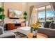 Cozy living room with a large television, comfortable seating and a view of the outdoors at 3228 Brasilia Ave, Kissimmee, FL 34747