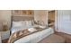 Bright bedroom with a king bed, decorative art, and access to an ensuite bathroom at 3228 Brasilia Ave, Kissimmee, FL 34747