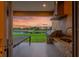 Covered patio includes a complete outdoor kitchen with a dining table and a view of the water at 3228 Brasilia Ave, Kissimmee, FL 34747