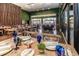 Elegant restaurant space with set tables, bar, and natural light at 3228 Brasilia Ave, Kissimmee, FL 34747