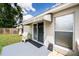The house shows a cozy backyard with a small patio and sliding glass doors, offering an intimate outdoor retreat at 3536 Moss Pointe Pl, Lake Mary, FL 32746