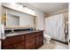 Elegant bathroom with double sink vanity, granite countertops and large mirror at 3536 Moss Pointe Pl, Lake Mary, FL 32746